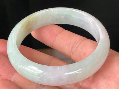 Rounded classic profile of 58.7mm icy milky white, green, and lavender Burmese jade bangle JB226