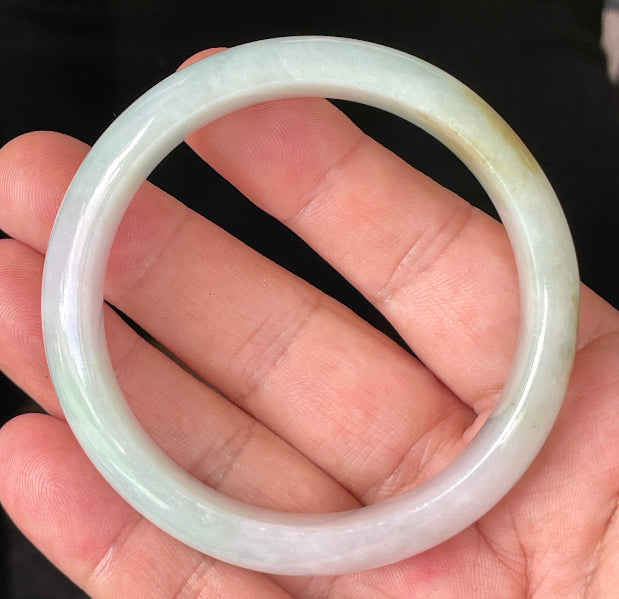 Rounded classic profile of 58.7mm icy milky white, green, and lavender Burmese jade bangle JB226
