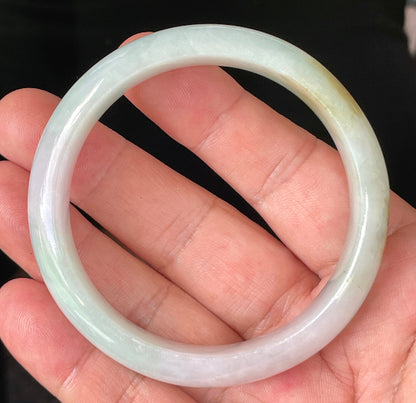 Rounded classic profile of 58.7mm icy milky white, green, and lavender Burmese jade bangle JB226