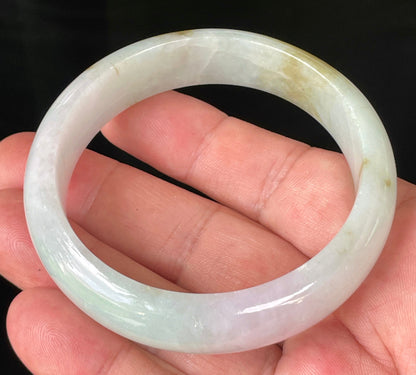 Rounded classic profile of 58.7mm icy milky white, green, and lavender Burmese jade bangle JB226
