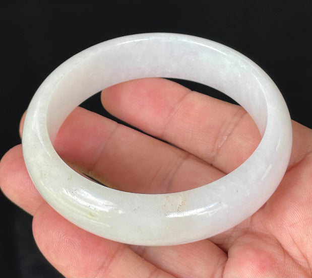 Flat inner and round outer edges of 58.5mm icy milky white and honey Burmese jade bangle JB827