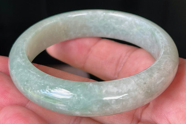 Rounded classic profile of 55mm icy green Burmese jade bangle JB518