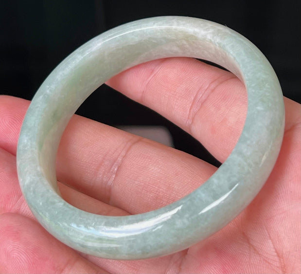 Rounded classic profile of 55mm icy green Burmese jade bangle JB518