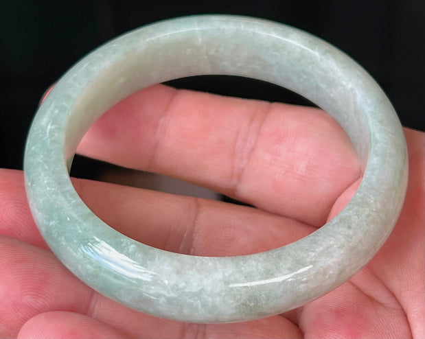 Rounded classic profile of 55mm icy green Burmese jade bangle JB518