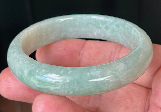 Rounded classic profile of 55mm icy green Burmese jade bangle JB518