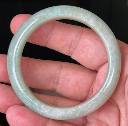 Rounded classic profile of 55mm icy green Burmese jade bangle JB518