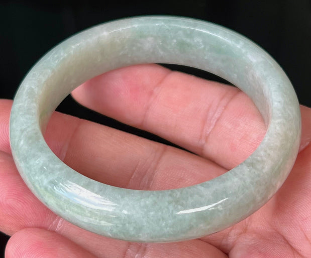 Rounded classic profile of 55mm icy green Burmese jade bangle JB518