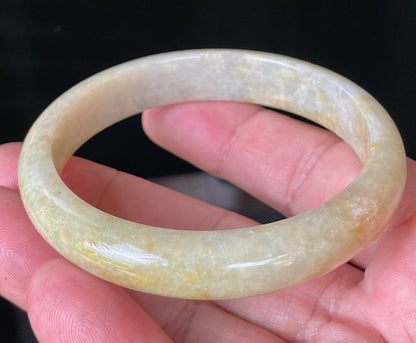 Flat inner and round outer edges of 58.5mm icy yellow, honey orange, and milky white Burmese jade bangle JB923