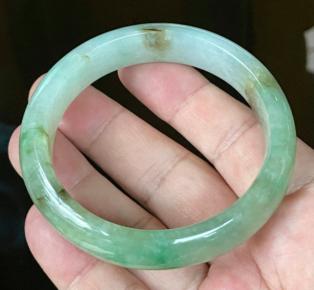 Flat inner and round outer edges of 58.6mm bluish white, green, and honey Burmese jade bangle JB120