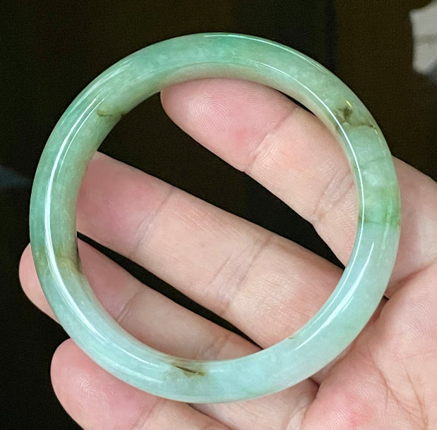 Flat inner and round outer edges of 58.6mm bluish white, green, and honey Burmese jade bangle JB120