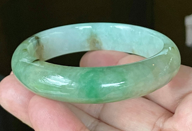 Flat inner and round outer edges of 58.6mm bluish white, green, and honey Burmese jade bangle JB120