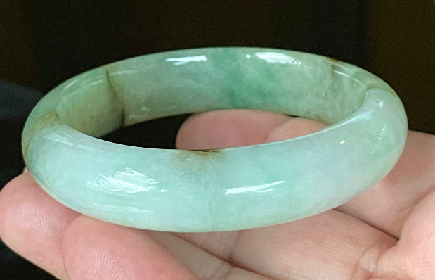 Flat inner and round outer edges of 58.6mm bluish white, green, and honey Burmese jade bangle JB120