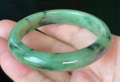 Flat inner and round outer edges of 58mm icy apple green and black floral Burmese jade bangle JB905