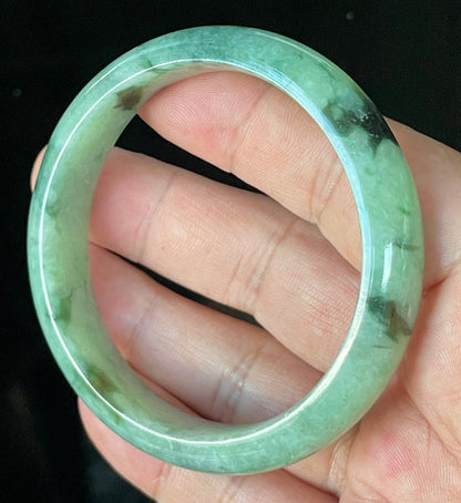 Flat inner and round outer edges of 57.5mm icy apple, imperial green, black, and white Burmese jade bangle JB911