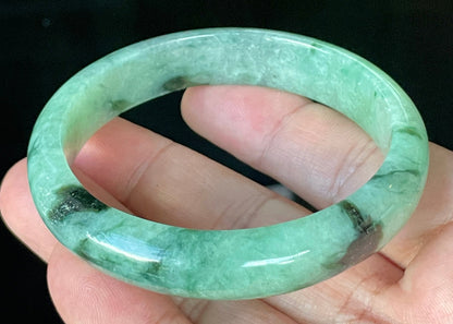 Flat inner and round outer edges of 57.5mm icy apple, imperial green, black, and white Burmese jade bangle JB911
