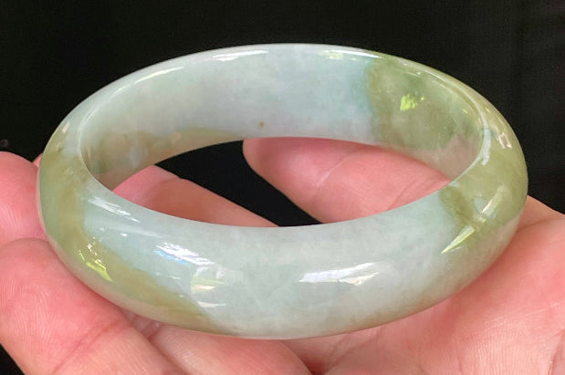 Flat inner and round outer edges of 57.5mm icy apple green, moss green, and bluish white Burmese jade bangle JB032