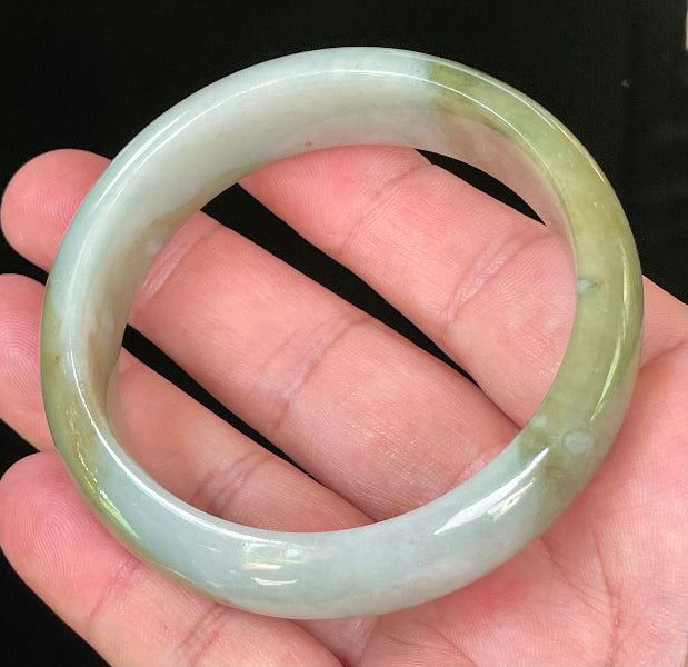 Flat inner and round outer edges of 57.5mm icy apple green, moss green, and bluish white Burmese jade bangle JB032