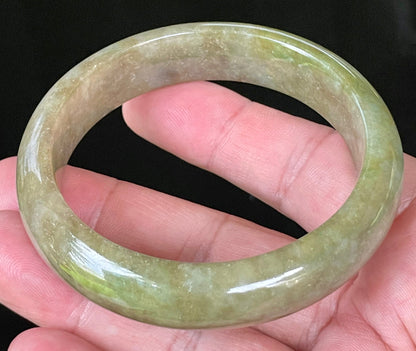 Flat inner and round outer edges of 58mm icy apple, forest green, and milky honey white Burmese jade bangle JB040