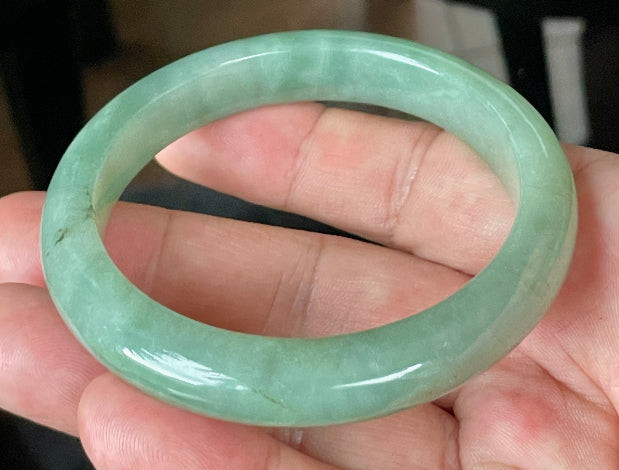 Flat inner and round outer edges of 58.5mm icy apple and imperial green Burmese jade bangle JB922