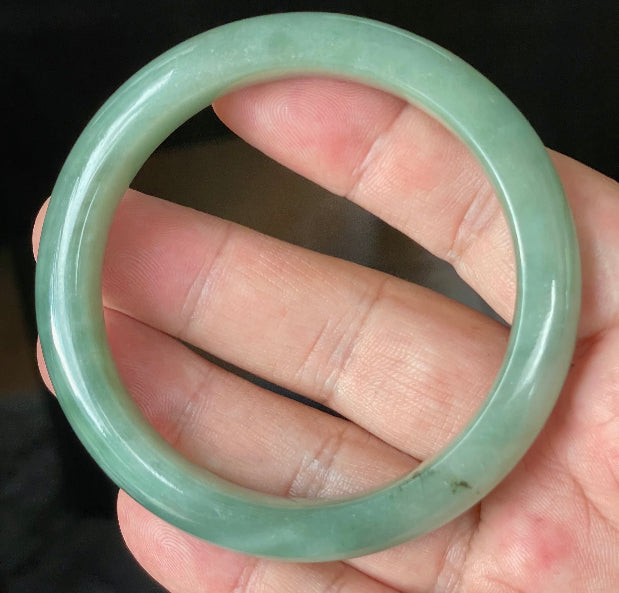 Flat inner and round outer edges of 58.5mm icy apple and imperial green Burmese jade bangle JB922