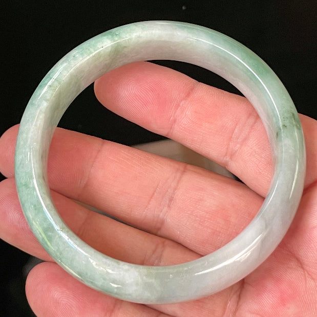 Flat inner and round outer edges of 58mm icy imperial green and greyish white Burmese jade bangle JB004