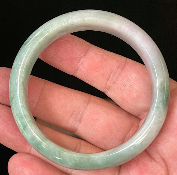 Flat inner and round outer edges of 58mm icy imperial green and greyish white Burmese jade bangle JB004