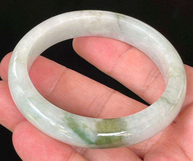 Flat inner and round outer edges of 57.5mm icy apple, moss green, and greyish white Burmese jade bangle JB025