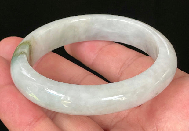 Flat inner and round outer edges of 57.5mm icy apple, moss green, and greyish white Burmese jade bangle JB025