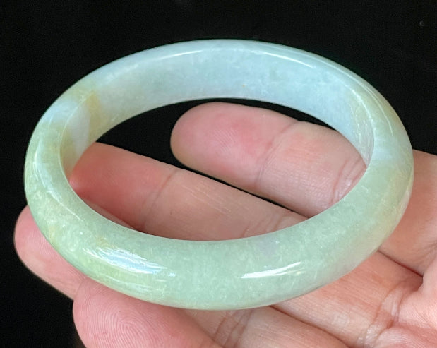 Flat inner and round outer edges of 57mm icy apple green, lavender, and milky white Burmese jade bangle JB912