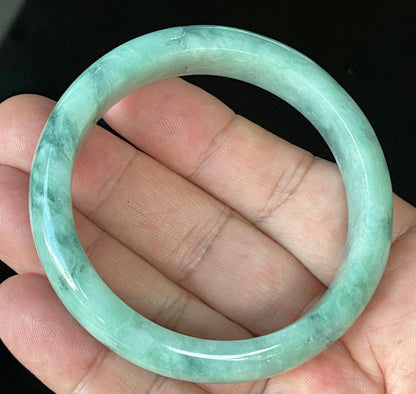 Flat inner and round outer edges of 56mm icy imperial, apple green, and milky white Burmese jade bangle JB914
