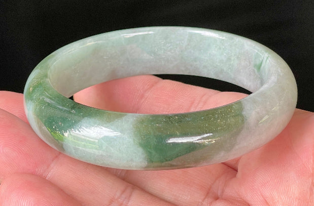 Flat inner and round outer edges of 58.5mm icy greyish white and apple green Burmese jade bangle JB039