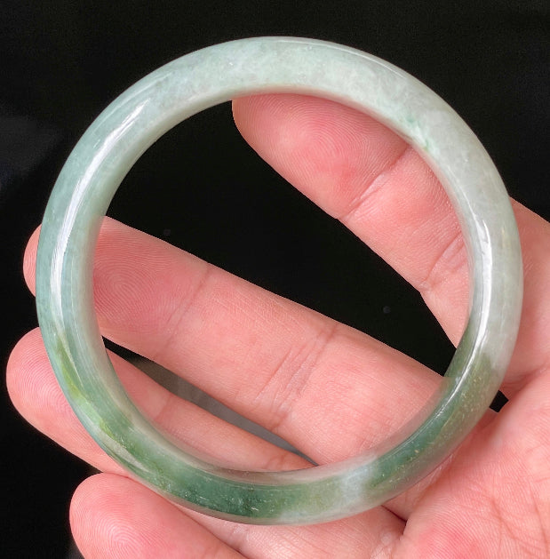 Flat inner and round outer edges of 58.5mm icy greyish white and apple green Burmese jade bangle JB039