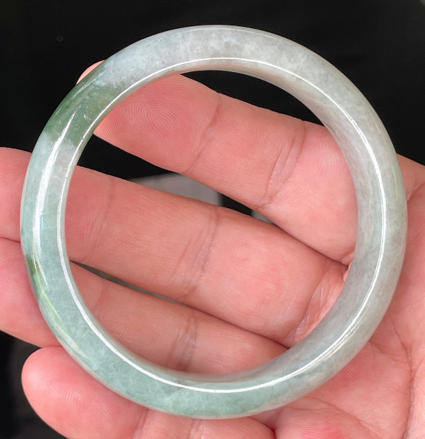 Flat inner and round outer edges of 58.5mm icy greyish white and apple green Burmese jade bangle JB039