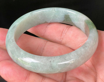Flat inner and round outer edges of 58.5mm icy greyish white and apple green Burmese jade bangle JB039
