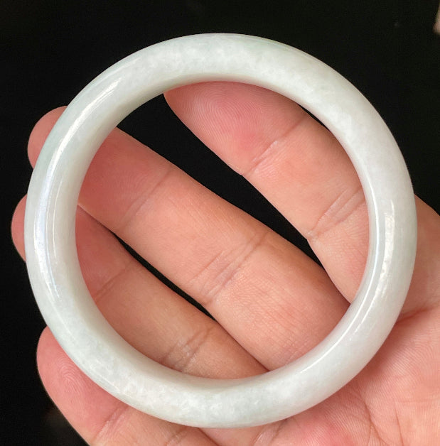 Flat inner and round outer edges of 57.5mm icy milky white and apple green Burmese jade bangle JB921