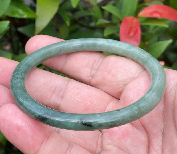 Slim profile icy apple green and moss green natural Type A Burmese jade bangle bracelet in size 60.8mm