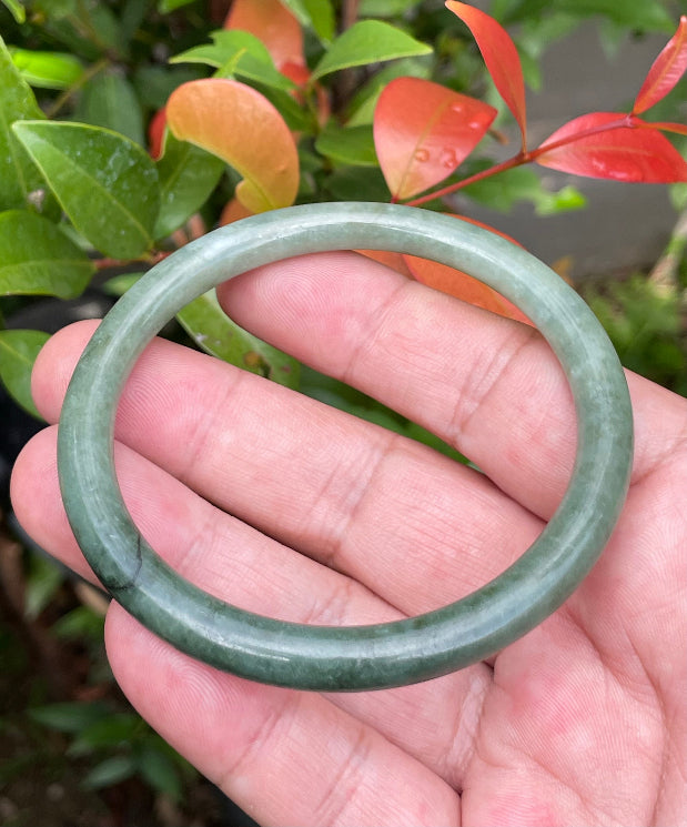 Slim profile icy apple green and moss green natural Type A Burmese jade bangle bracelet in size 60.8mm