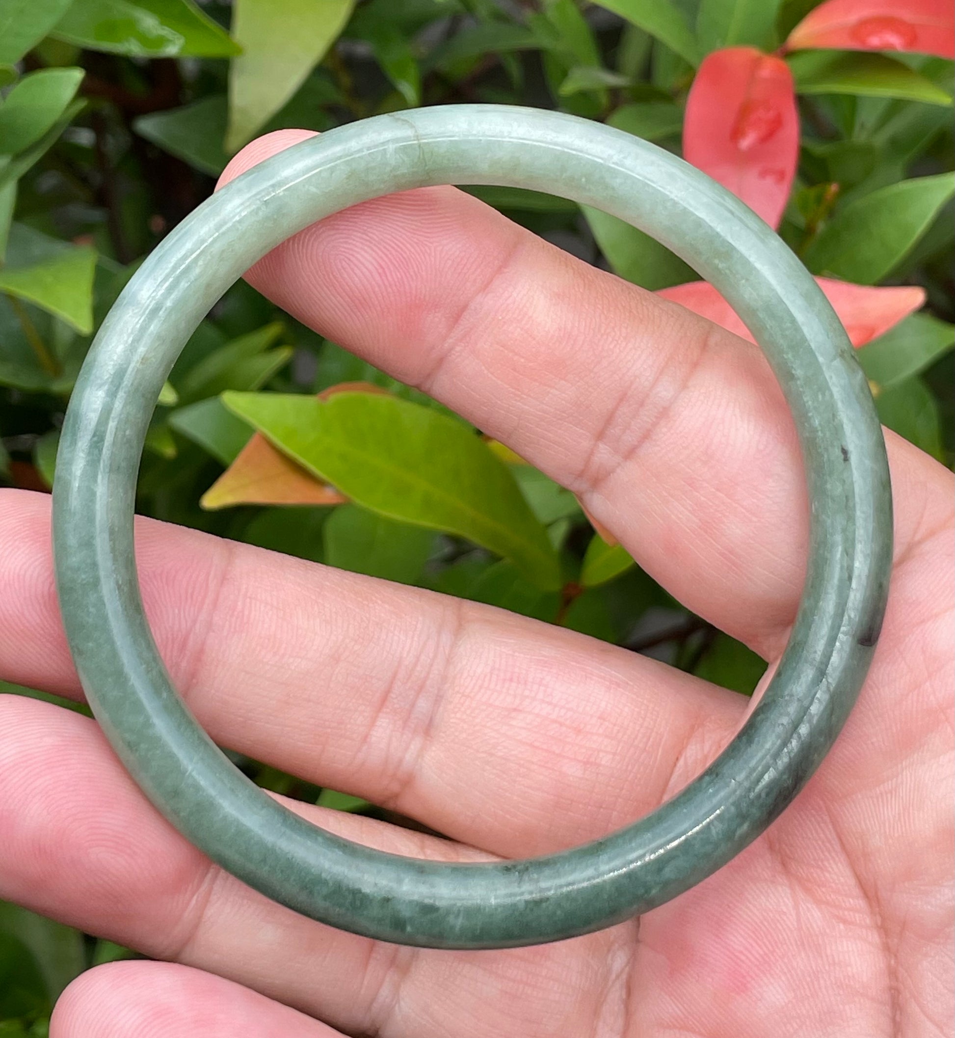Slim profile icy apple green and moss green natural Type A Burmese jade bangle bracelet in size 60.8mm