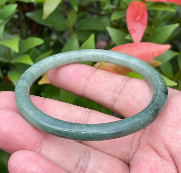 Slim profile icy apple green and moss green natural Type A Burmese jade bangle bracelet in size 60.8mm