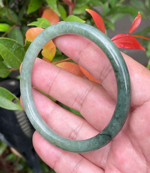 Slim profile icy apple green and moss green natural Type A Burmese jade bangle bracelet in size 60.8mm