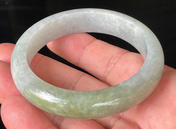 Flat inner and round outer edges of 56.2mm icy apple green, greyish white, and lavender Burmese jade bangle JB203