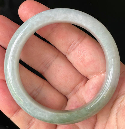 Flat inner and round outer edges of 56.2mm icy apple green, greyish white, and lavender Burmese jade bangle JB203