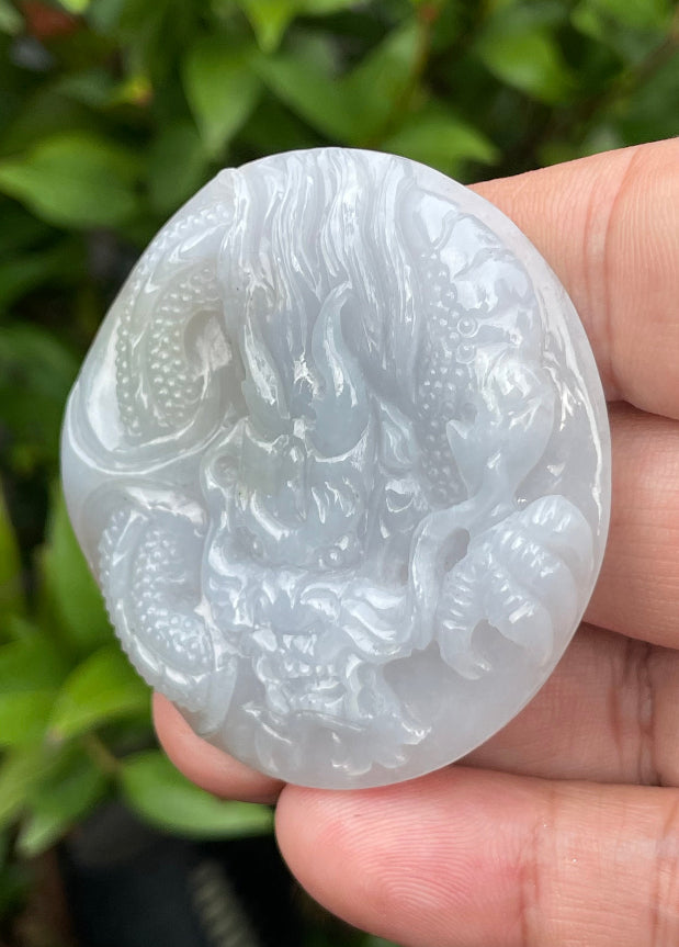 Fine texture of the authentic Myanmar jade pendant JP051 showcasing a traditional Dragon Feng Shui design for protection and resilience