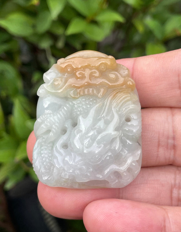 Fine texture of the authentic Myanmar jade pendant JP064 showcasing a traditional Dragon Feng Shui design for protection and power