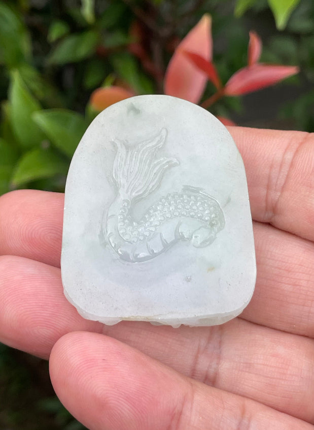 Fine texture of the authentic Myanmar jade pendant JP064 showcasing a traditional Dragon Feng Shui design for protection and power