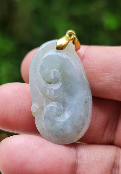 Medium texture of the authentic Myanmar jade pendant JOP002 showcasing a hand-carved Ruyi Swirl Feng Shui design for harmony