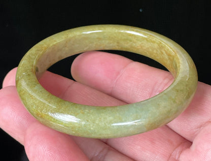 Flat inner and round outer edges of 52.4mm moss green, apple green, and brown Burmese jade bangle JB872