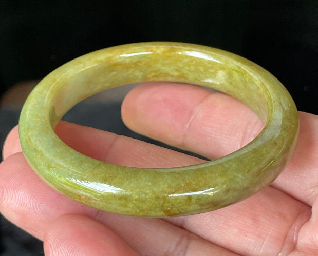Flat inner and round outer edges of 52.4mm moss green, apple green, and brown Burmese jade bangle JB872