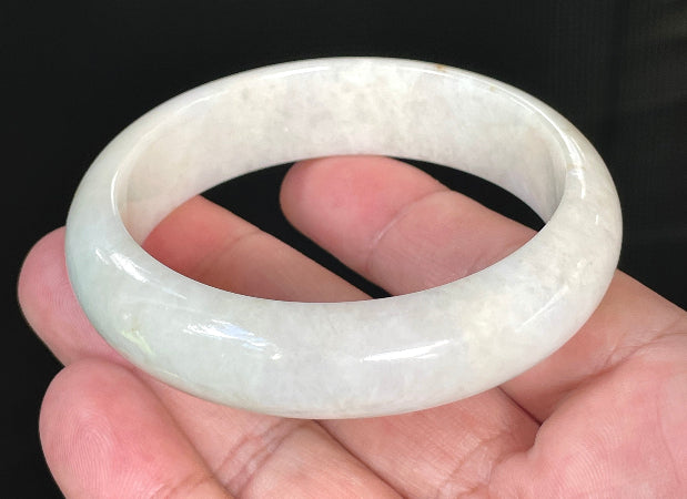 Flat inner and round outer edges of 57.4mm icy milky white, light yellow, and honey Burmese jade bangle JB805