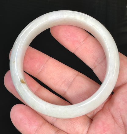 Flat inner and round outer edges of 57.4mm icy milky white, light yellow, and honey Burmese jade bangle JB805